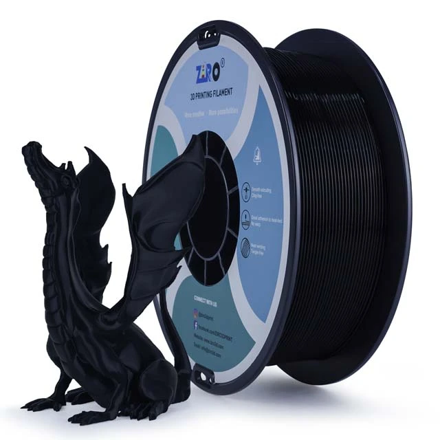Black 3D printer filament spool with a dragon model beside it.
