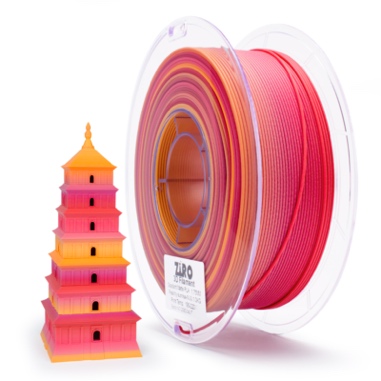 Colorful 3D printer filament spool next to a pink multi-tiered pagoda model.