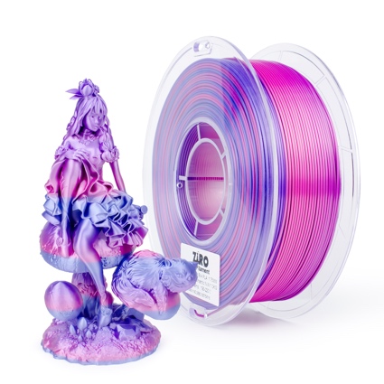 A vibrant purple and pink 3D printer filament spool beside a colorful printed dragon figurine.
