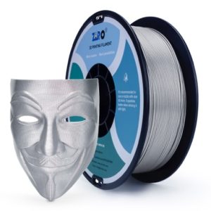 Silver Guy Fawkes mask beside a spool of 3D printer filament.