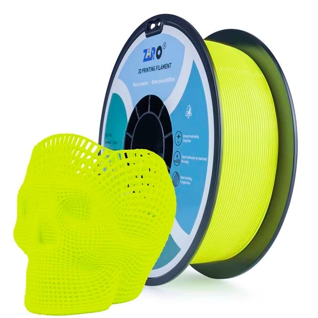 A spool of bright yellow 3D printer filament with a skull-shaped 3D print.