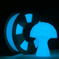 Abstract blue and black geometric shapes illuminated in dark.