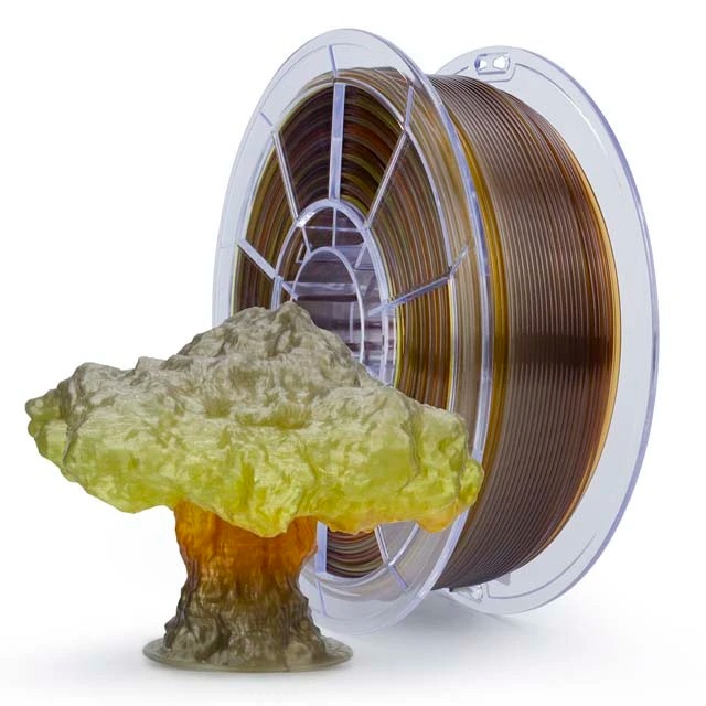 A spool of 3D printing filament with a yellow resin-like splash effect.
