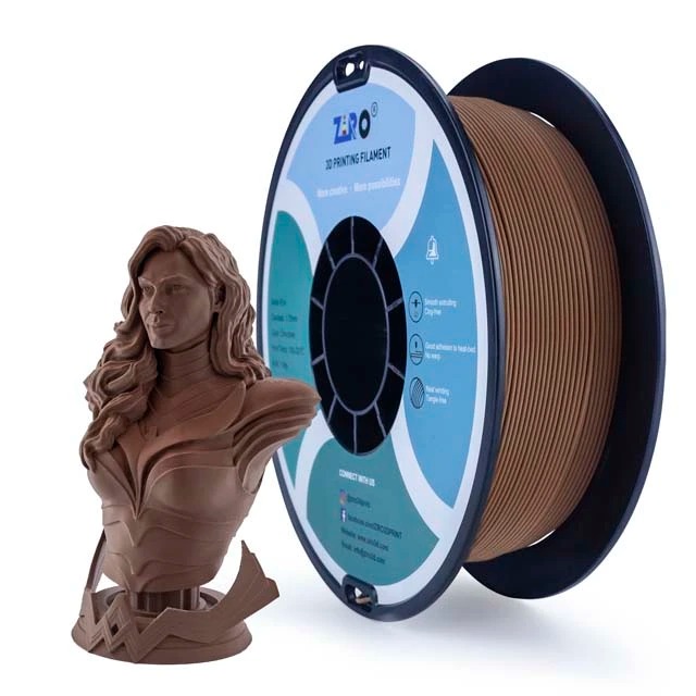 3D printer filament spool with a printed brown bust sculpture.