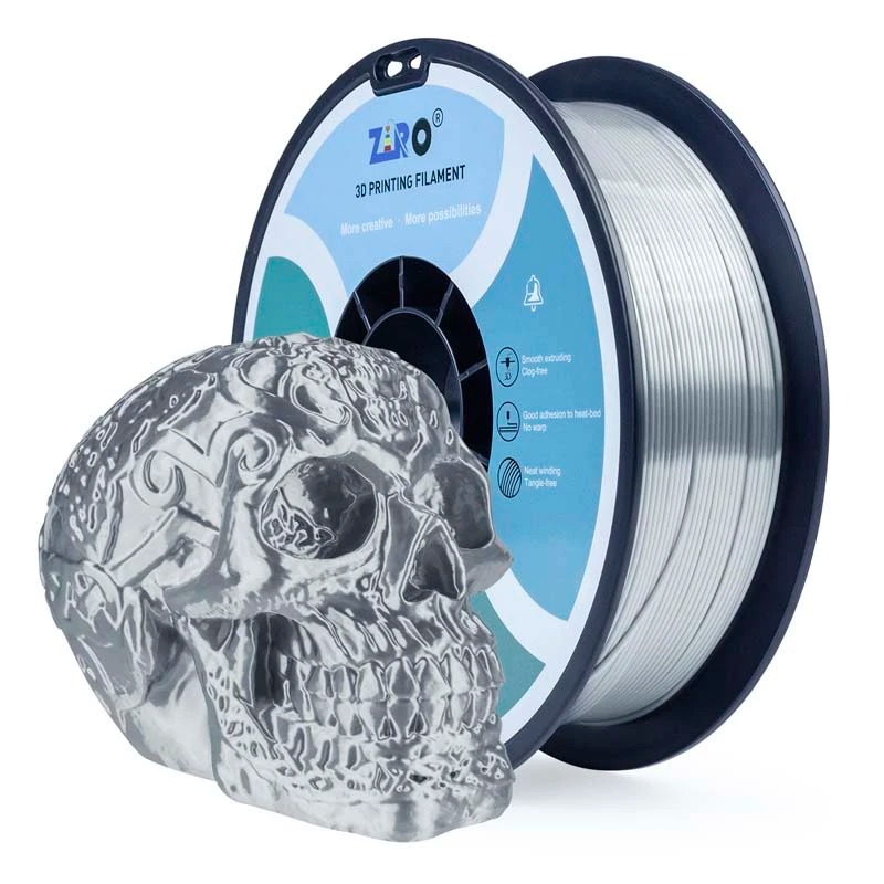 A spool of translucent filament with a skull-shaped resin model beside it.